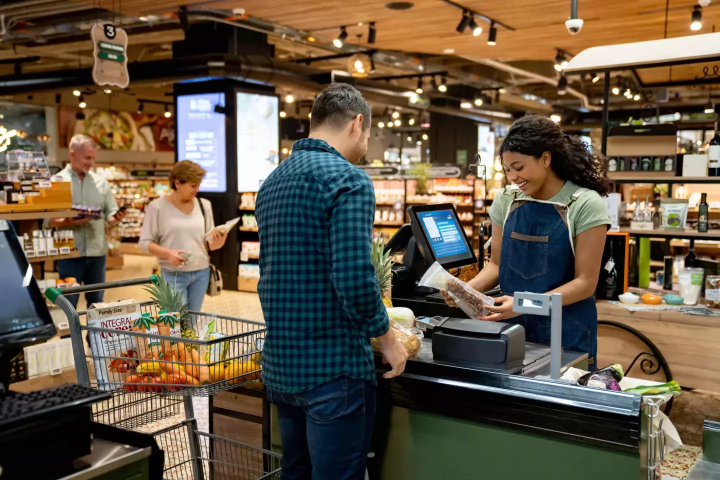 Man checking out at a grocery store